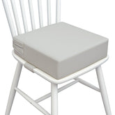 AAAini booster seat front view highlights secure straps for stable dining on the go.