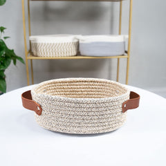 ABenkle decorative nursery basket holds small toys neatly.