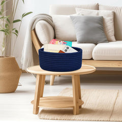 ABenkle mini basket in nursery keeps diapers and wipes within reach.