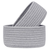 ABenkle small oval basket in cotton rope for compact storage and desk organization.