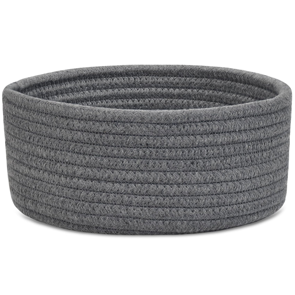 ABenkle small round basket on desk for tidy desk organization.