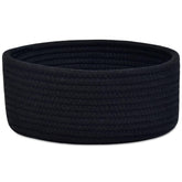 ABenkle small round basket on shelf for compact storage of keys and cosmetics.