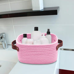 ABenkle pink storage basket closeup shows cotton rope weave and soft texture.