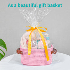 ABenkle pink storage basket in use on desk with supplies.