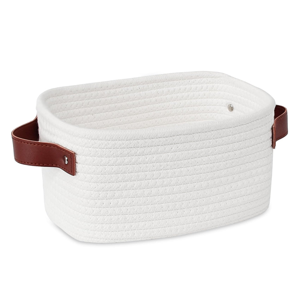 ABenkle small storage basket with white handle keeps compact items neatly organized.
