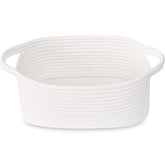 ABenkle small white basket on shelf keeps shelves tidy.