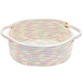 ABenkle small woven basket on shelf keeps toys organized.