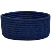 ABenkle small woven basket on a desk for tidy desk storage.