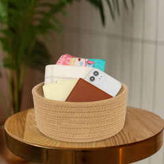 ABenkle nursery storage basket keeps small toys and baby supplies neatly within reach.