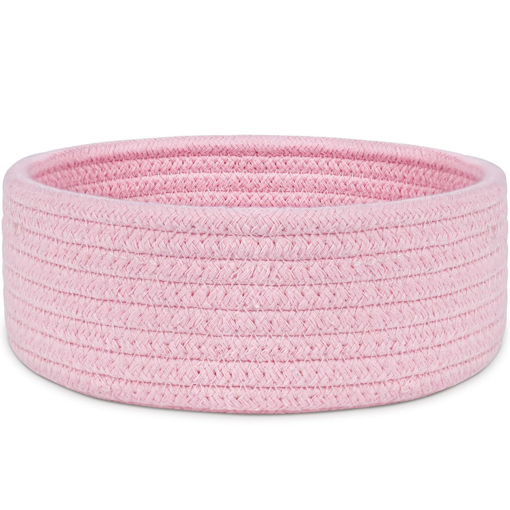 ABenkle small woven pink basket on a shelf for tidy desk storage