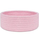 ABenkle small woven pink basket on a shelf for tidy desk storage
