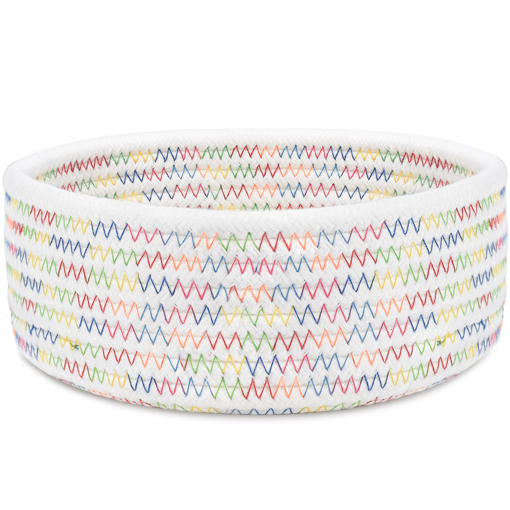 ABenkle small woven basket on desk for organizing keys and cosmetics.