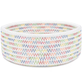 ABenkle small woven basket on desk for organizing keys and cosmetics.