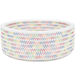 ABenkle small woven basket on desk for organizing keys and cosmetics.