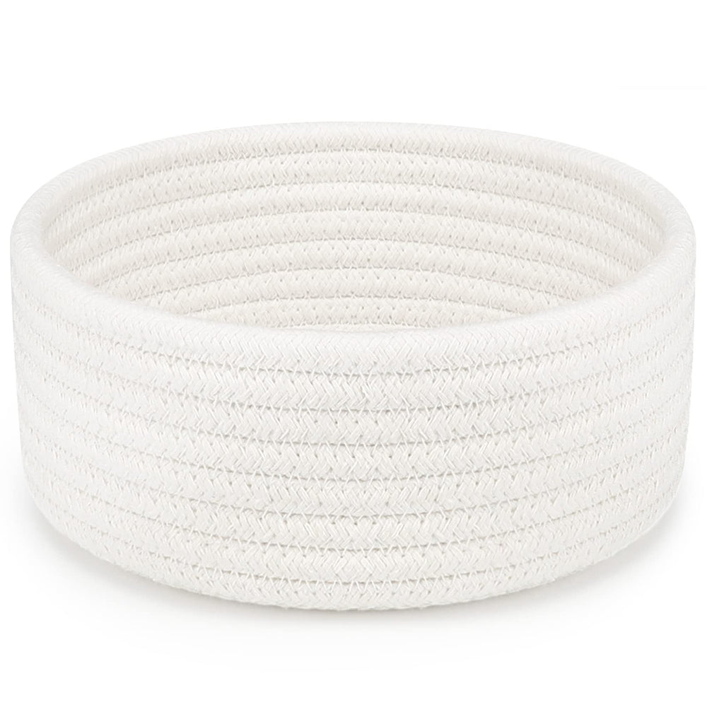 ABenkle small woven basket white side view, ideal for organizing remotes and small essentials.