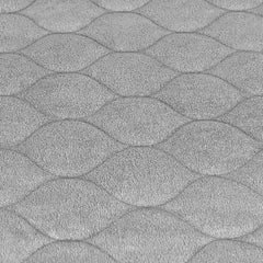 Accmor changing pad liner in use on a table demonstrates a soft, quilted surface for baby comfort.