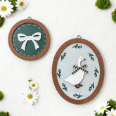 AceOrbit silly goose wall art in a wooden round frame adds playful nursery charm