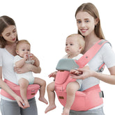 Acumas baby carrier hip seat pink front view with ergonomic support for parents.
