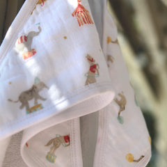 aden + anais Essentials hooded towel Elephant Circus large towel laid out for drying