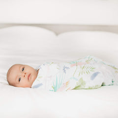 aden + anais Essentials Swaddle Tropicalia blanket serving as a nursing cover