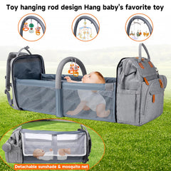 AHNTTGS Up-Grey bag in use with stroller buckles for hands-free travel.