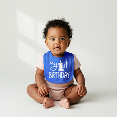 Aiden's Corner My 1st Birthday bib adjustable neck demonstrates secure fit for babies.