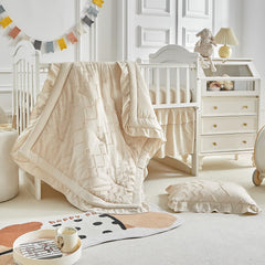 AIKASY ruffled crib comforter in soft fabric, ideal for cozy naps and gentle use.