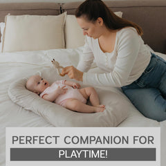 Aila + Aiden baby lounger portable with carry handles for travel-friendly use.