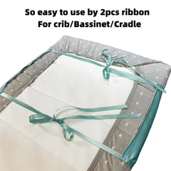 AKISS satin crib-sheet fitted view shows secure elastic fit for cribs or cradles.