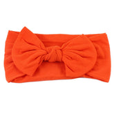 AKOAK orange baby headband, front view, skin-friendly nylon for daily wear.
