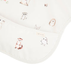 Ali+Oli Smock Bib Woodlands folded demonstrates compact, travel-ready convenience
