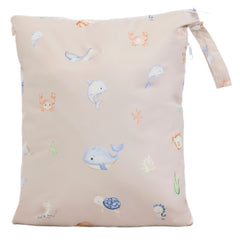 Ali+Oli wet-dry bag open with dual compartments for organized travel storage.