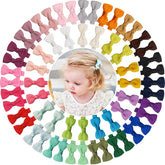 ALinmo baby hair clips 60-piece set with 2-inch bows for easy, colorful pigtail styling.