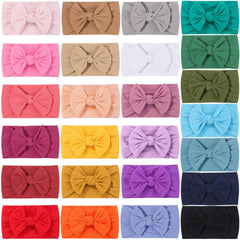 ALinmo soft nylon headbands on baby show gentle stretch and comfortable fit.