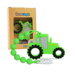 AmazingM tractor teether in green provides gum soothing during playtime.