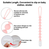 AmazingM teether in baby hand shows easy-grasp design for tiny fingers