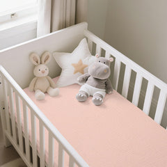 Amrcbb organic muslin crib sheet close-up texture feels ultra soft and smooth