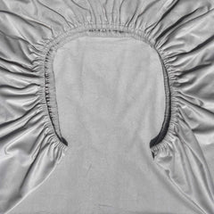 AMROSE crib sheet on standard mattress demonstrates proper sizing for standard crib mattresses.