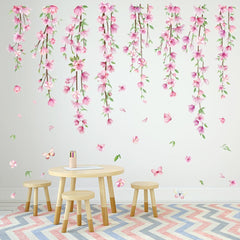 Amtoodopin pink flower vine wall decal in a nursery creates a playful backdrop