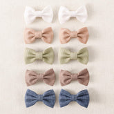 Amybasic 10pcs baby girl hair bow clip close-up showing gentle, non-slip grip for fine hair.