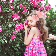 Amybasic bow with safety-wrap clip offers secure hold during active play