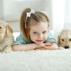 Amybasic non-slip lined baby bow clip image highlighting secure hold on delicate infant hair.