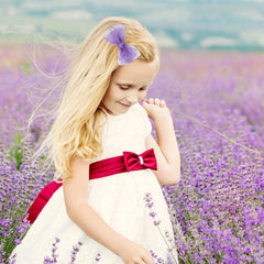 Amybasic organza bow clip purple close-up with satin wrap for secure hold.