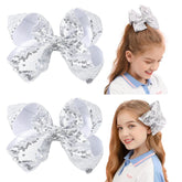 AMYDECOR 6inch silver glitter sequin hair bow with alligator clip for secure party-ready styling.