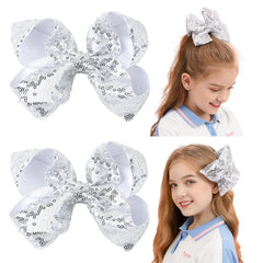 AMYDECOR 6inch silver glitter sequin hair bow with alligator clip for secure party-ready styling.