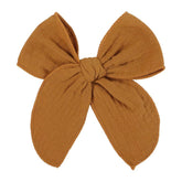 AMYDECOR dark yellow fable bow clip with linen and cotton for gentle wear.