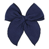 AMYDECOR navy blue Fable bow close-up showing soft linen cotton texture for gentle wear.