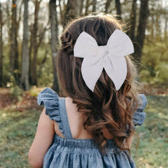 AMYDECOR Fable bow white clip showcases sturdy alligator clip for secure daily wear