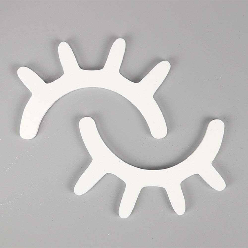Amyzor sleepy eyes wall decor in white with wooden lashes for nursery walls.