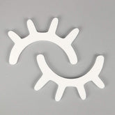 Amyzor sleepy eyes wall decor in white with wooden lashes for nursery walls.